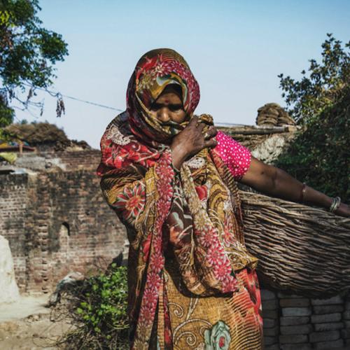 A woman in India covers her face during the coronavirus pandemic