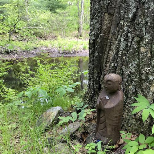 Jizo figure by the river